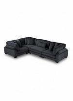 Sofa modulaire d'angle TOCO Meubles Traverse en velours côtelé noir avec assises profondes et coussins assortis