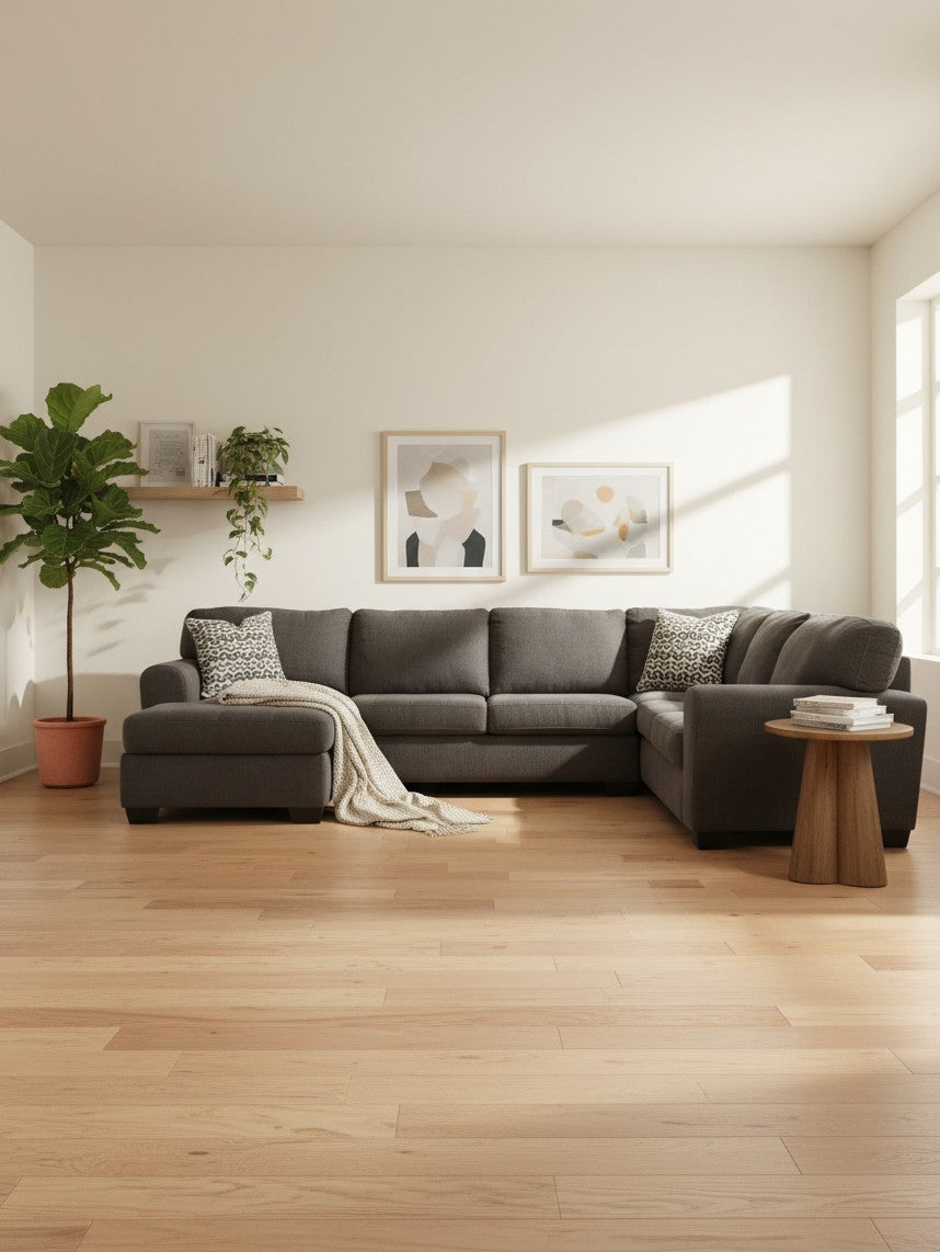 Sofa sectionnel Ambee TOCO Meubles couleur ardoise avec chaise longue, coussins à motifs et plaid dans un salon moderne