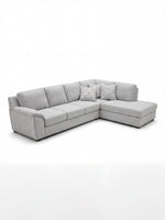 Sofa sectionnel gris TOCO Meubles avec méridienne et coussins décoratifs à motifs géométriques, design moderne.