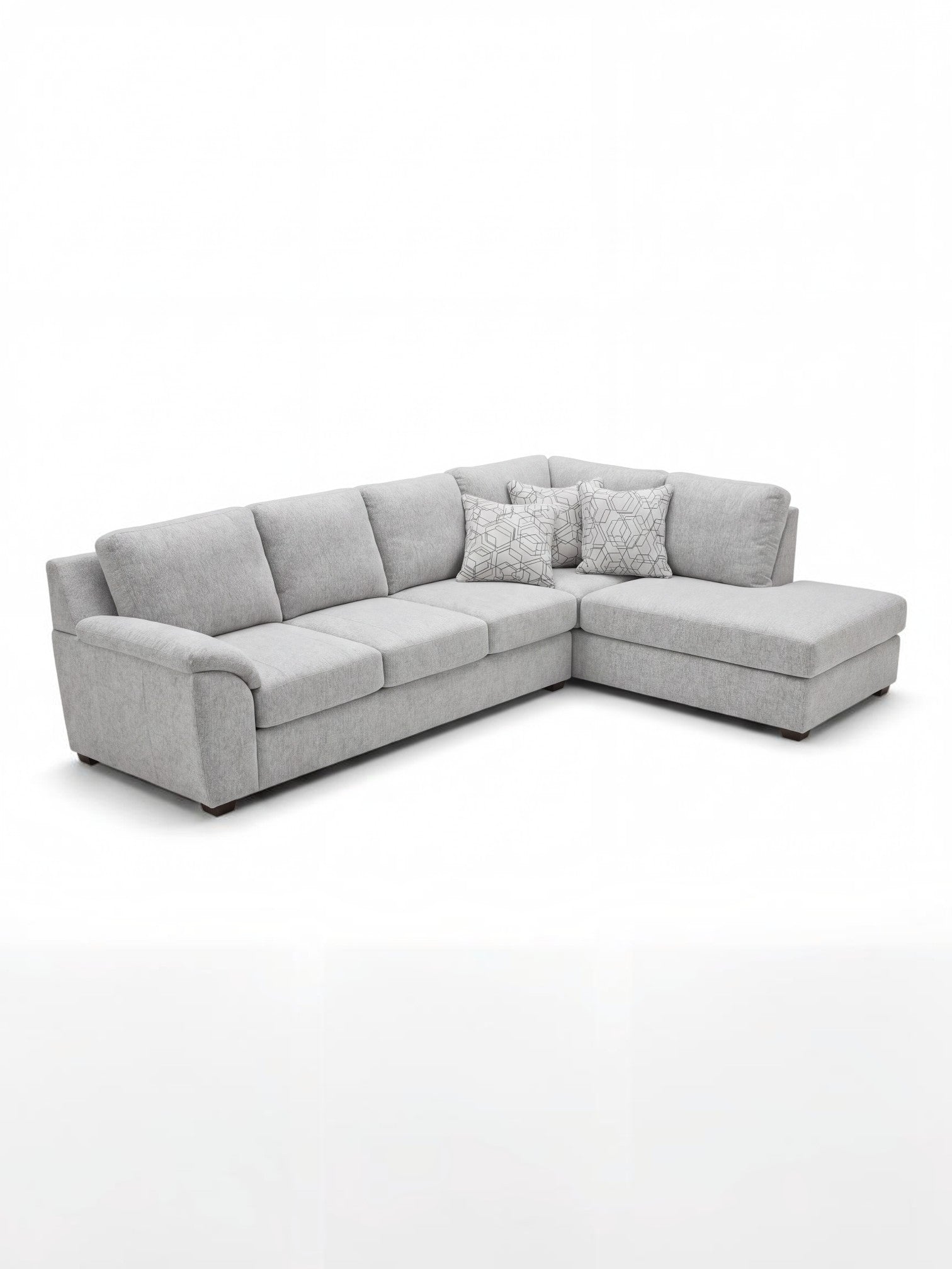 Sofa sectionnel gris TOCO Meubles avec méridienne et coussins décoratifs à motifs géométriques, design moderne.
