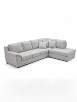 Sofa sectionnel gris TOCO Meubles avec méridienne et coussins décoratifs à motifs géométriques, design moderne.