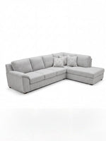 Sofa sectionnel gris TOCO Meubles avec méridienne et coussins décoratifs à motifs géométriques, design moderne.