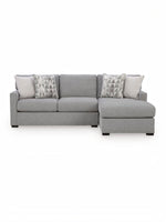 Sofa sectionnel Alba gris par TOCO Meubles avec coussins décoratifs à motifs géométriques sur fond blanc