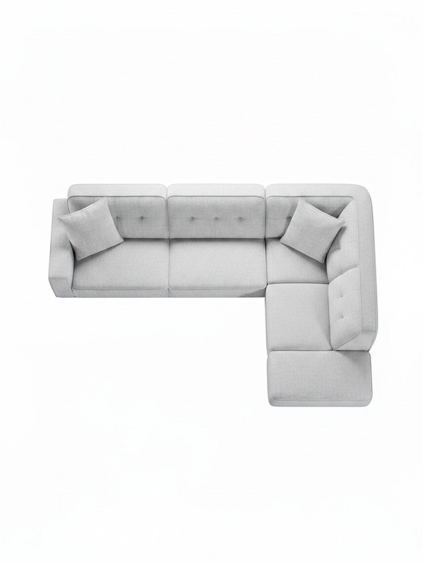Sofa sectionnel Célestin de TOCO Meubles, canapé d'angle gris clair avec coussins, vue de dessus