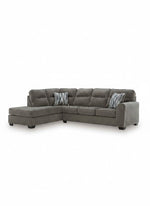 Sofa sectionnel Brutus de TOCO Meubles en tissu gris avec méridienne et coussins décoratifs rayés