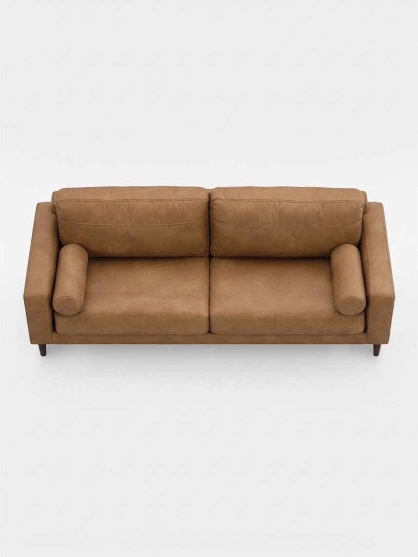 Sofa Telora TOCO Meubles en cuir caramel avec coussins cylindriques vue de dessus