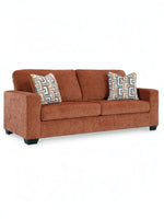 Sofa Toscana TOCO Meubles en tissu texturé couleur rouille avec deux coussins décoratifs à motifs géométriques