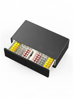 Table basse intelligente TOCO Meubles Party Time noire avec deux tiroirs ouverts remplis de boissons et collations