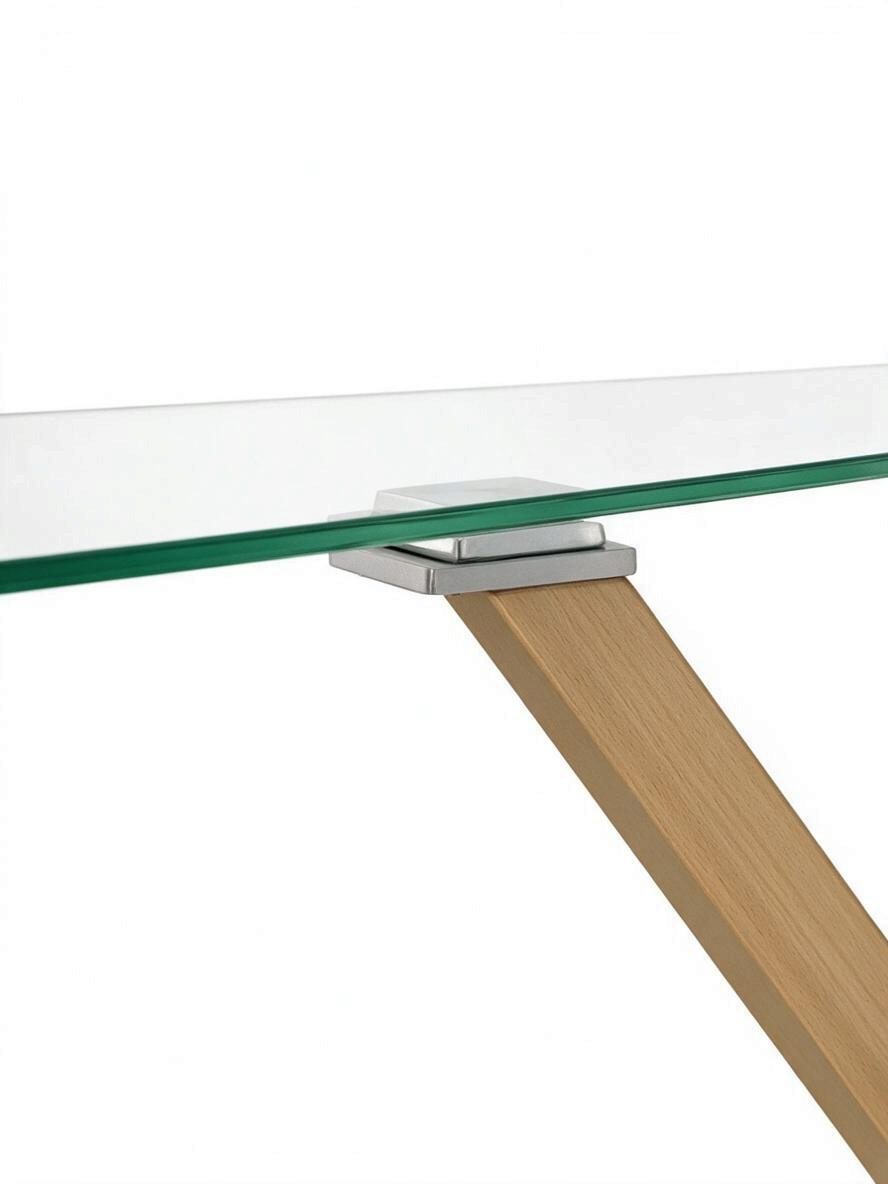 Détail de la table de salle à manger Elena par TOCO Meubles montrant le plateau en verre trempé et support en métal