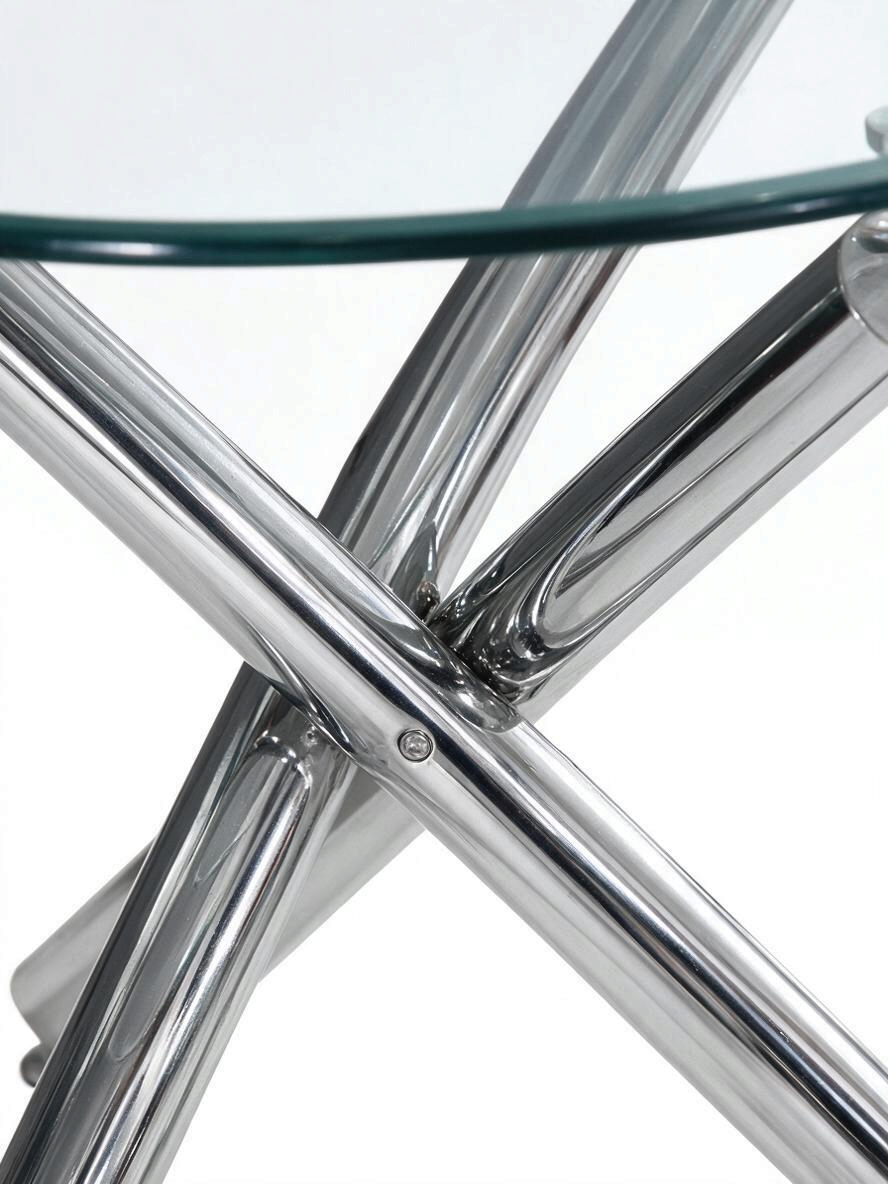 Base croisée en métal chromé brillant de la table ronde TOCO Meubles Lara avec plateau en verre trempé transparent