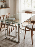 Table de salle à manger Leros TOCO Meubles avec plateau en verre trempé et base géométrique en acier argent poli