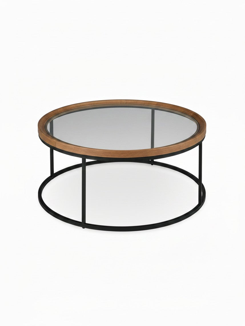 Table de salon ronde Nora de TOCO Meubles avec plateau en verre, bordure en bois naturel et structure en métal noir