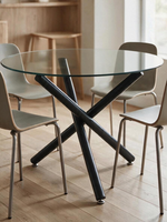 Table de salle à manger ronde Suzy par TOCO Meubles avec plateau en verre trempé et base croisée en métal noir mat