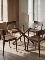 Table de salle à manger ronde Rocco par TOCO Meubles avec plateau en verre trempé et base croisée effet noyer