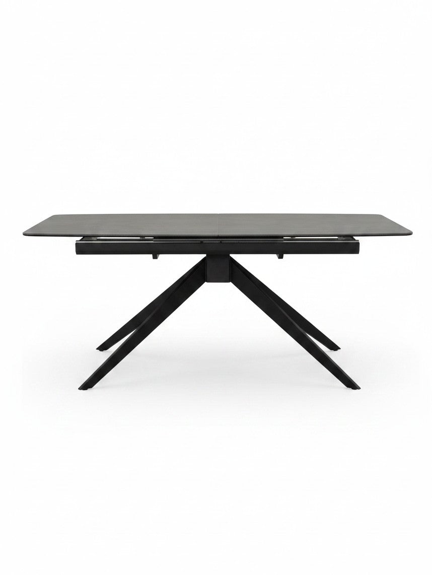 Table de salle à manger extensible Julia noire de TOCO Meubles avec un design moderne et des pieds croisés