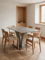 Table de salle à manger Apolla TOCO Meubles avec plateau effet marbre gris et base géométrique moderne en acier