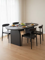 Table de salle à manger Arco TOCO Meubles en bois massif teinté noir avec plateau ovale et chaises assorties