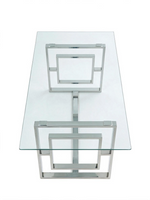 Table de salle à manger Leros TOCO Meubles avec plateau en verre trempé et base géométrique en acier argent poli