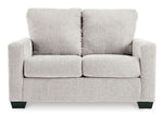 TOCO Meubles - Canapé-lit Jabari 2 places gris clair, tissu texturé, pieds noirs discrets. Design moderne et confortable.
