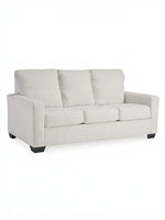 TOCO Meubles Canapé-lit Jabari 3 places blanc cassé en tissu texturé avec coussins moelleux et pieds noirs.