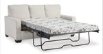 TOCO Meubles Canapé-lit Jabari 3 places beige en tissu, matelas à motif floral noir et blanc déplié.