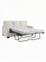 TOCO Meubles Canapé-lit Jabari 3 places beige en tissu, matelas à motif floral noir et blanc déplié.