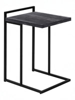 TOCO Meubles Eliott C-shaped side table with black wood-effect top and black metal frame.