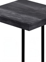 TOCO Meubles Eliott industrial C-shaped side table with dark wood effect top and black metal legs.